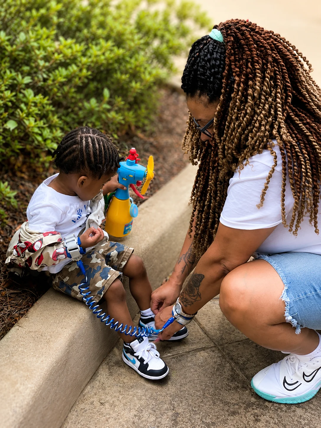 Companion attentively helping a child